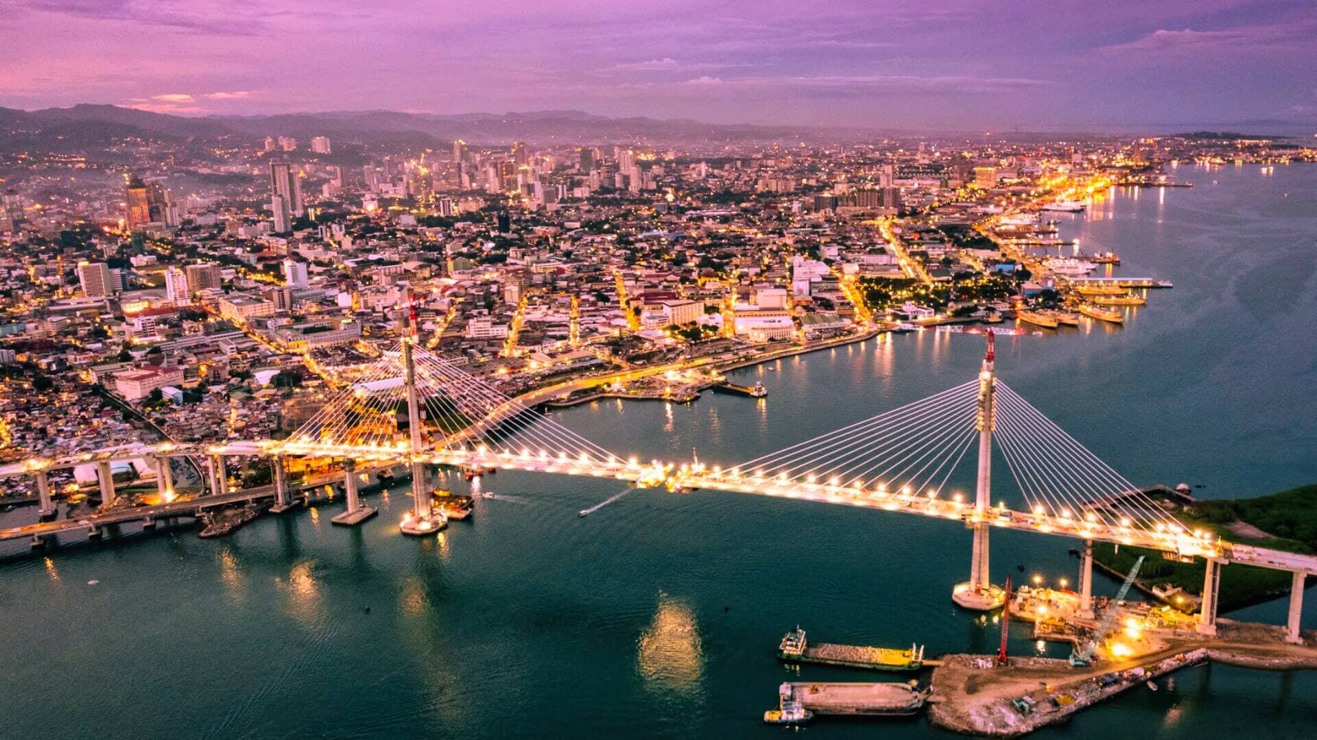 Cebu City skyline and bridge at dusk